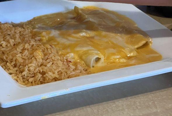 Cheese enchiladas with double rice, it normally comes with refried beans.