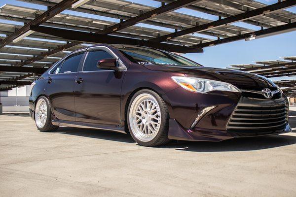 Toyota Camry Fully Wrapped in Hexis Vampire Black. Installed Front Lip/Side skirts/Rear Skirts/Spoiler