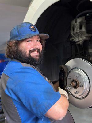 Tech Houston working on replacing brakes and rotors