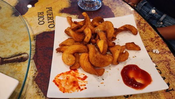 Curly fries with ketchup and special hot sauce.