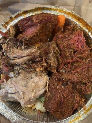 Beef ribs and pork shoulder over vegetables