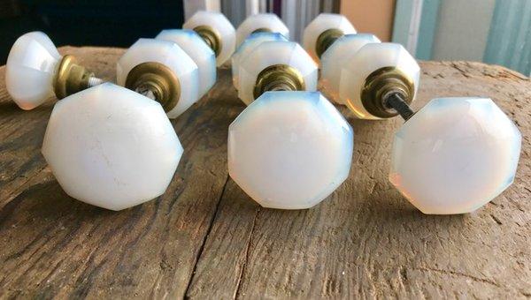 Milk glass door knobs with rare blue/purple hues.