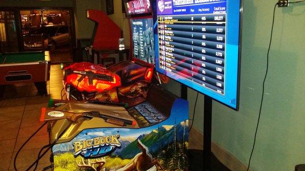 72 inch Big Buck Hunter screen along with other arcade and board games.