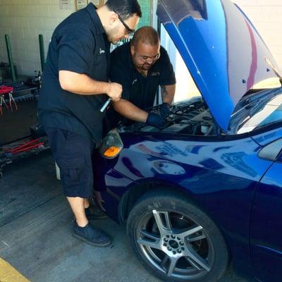 Our guys performing a battery install.  Heather's battery terminals were horribly corroded.  But we got her back on the road!