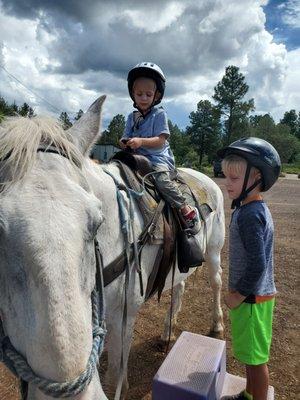 5 year old helping the 2year old feel more confident.