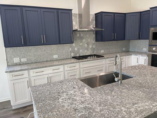 A custom designed water jetted marble backsplash.