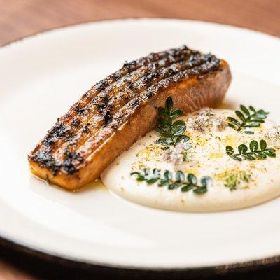 Crispy, fresh Ora King Salmon served alongside a tantalizing puree of fennel, celery and apple; and edible blossoms and kinome leaves.