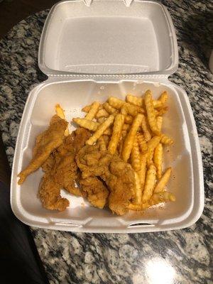 Chicken and fries with some Tony's sprinkled on top