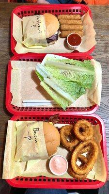 Bacon cheese burger, mozzarella sticks, protein style teriyaki burger, pastrami burger and onion rings.