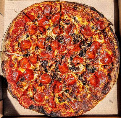 Large pepperoni and mushrooms pizza.