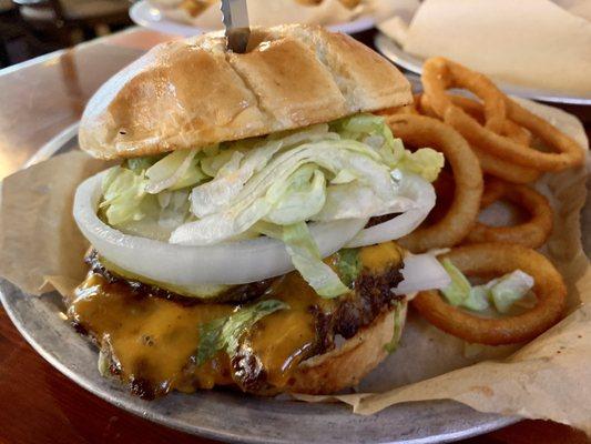 Good ol burger and onion rings. With a knife in it. The knife is was a little hard though. Rough around the edges.