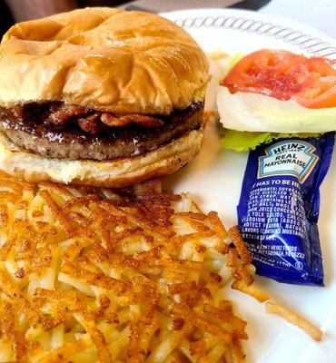 Angus bacon cheeseburger with hash browns - they place the tomato and lettuce on the side