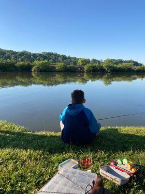 Kid waiting to catch a fish!