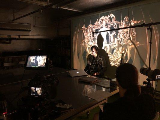 Using projections for a creative interview with artist and author Tobias Gremmler.