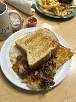 The Northerner - 2 eggs (om), Corned Beef hash, hash browns and Sourdough Toast, homemade Strawberry Preserves