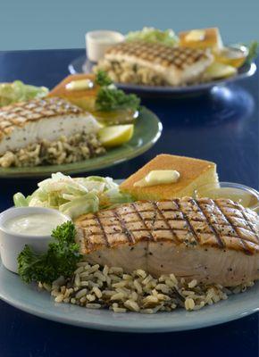 Ivar's grilled wild halibut and salmon platters, with wild rice, cornbread and cole slaw.