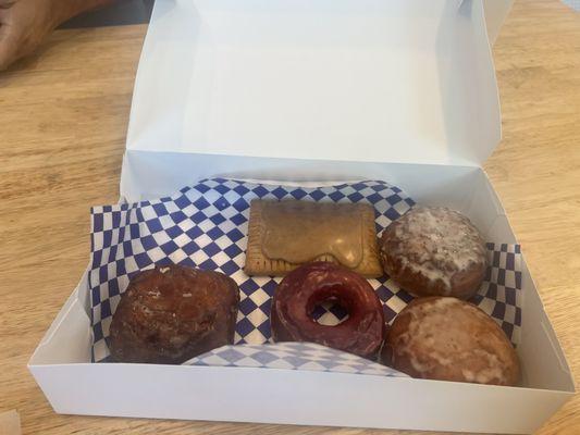 Cinnamon brown sugar pop tart, raspberry lemon and strawberry cream filled donuts, ube donut, apple fritter