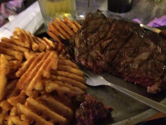 The ribeye with waffle fries.