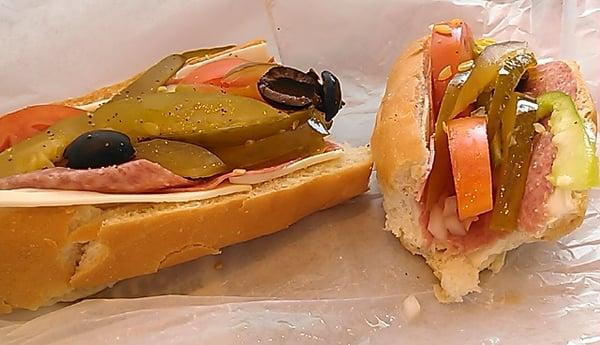 The maine italian, meat choice: salami. Am chz, chopped white onion, grn pepper, tomato, pickles, olives, spov, soft hot dog bun