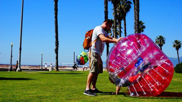 kids playing with their families in the Bubbleballs, they also have smallers bubbleballs for kids.