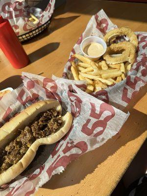 Philly cheesesteak, onion rings, fries.