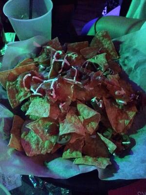 Photo shows nachos WITHOUT pork as the menu shows...