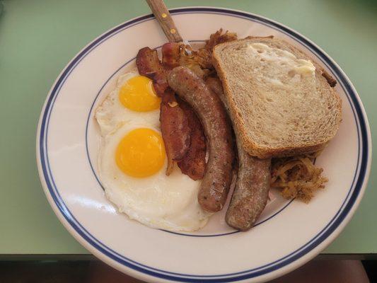 Mrs. B's Favorite: 2 sunny side up eggs, 2 bacon, 2 spicy sausage, spicy hashbrown and sourdough toast.