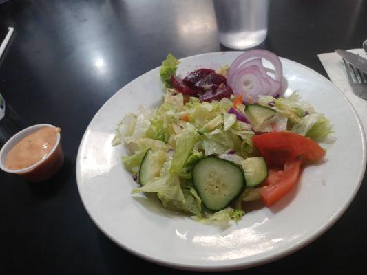 side salad-greens, cucumber, tomatoe and onion.