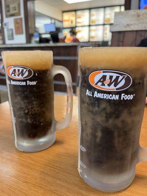 Fresh root beer in frosty mugs