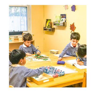 Preschool children working on Writing and Reading skills