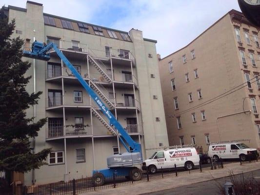 Installing an external chimney for apartment complex.