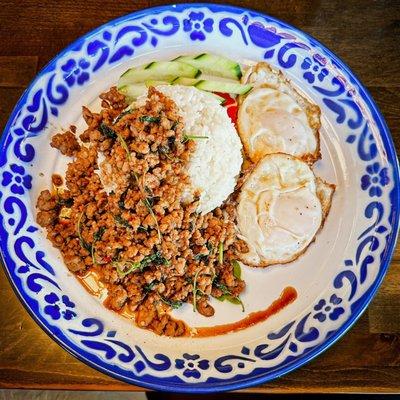 Mom's Holy Basil Pork. Simple.  Packed with flavor.  Just enough heat.  The fried eggs out it over the top.  Amazing!