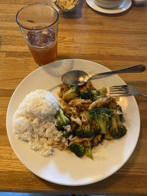 Chicken and broccoli with steamed rice.