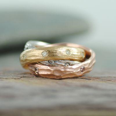 "Rolling Ring" composed of three handmade bands, masterfully welded together.