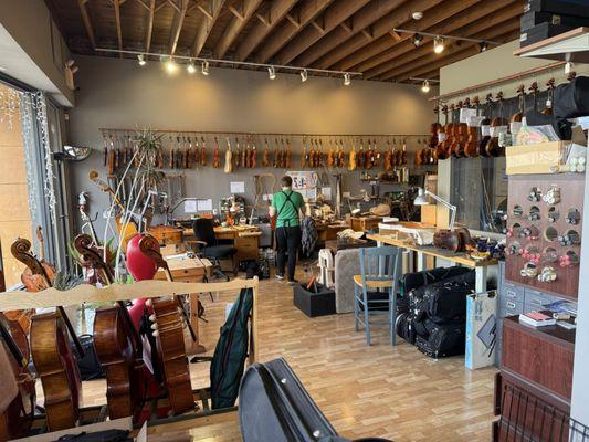 Staffer Ben Arnett takes our violin over to his work station for a good inspection.