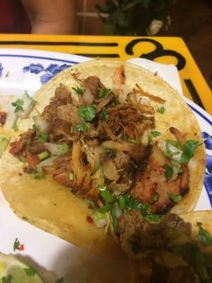 This is suppose to be their taco al pastor. You can obviously see the carnitas. It was hidden under the marinated chicken. Gross