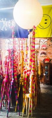 Colorful giraffe decorations, various flags, and various country masks.