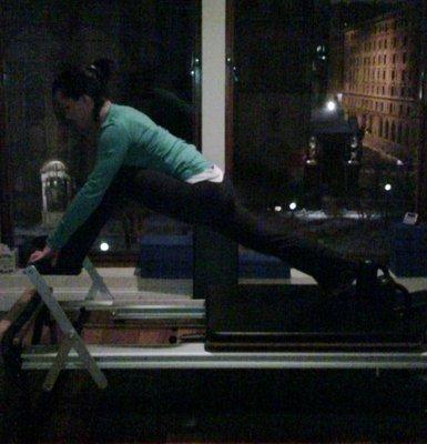 Laura in Front Splits on the Reformer