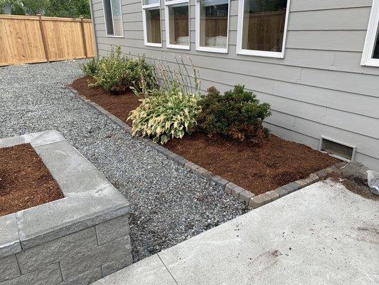 Retainer around flower beds.