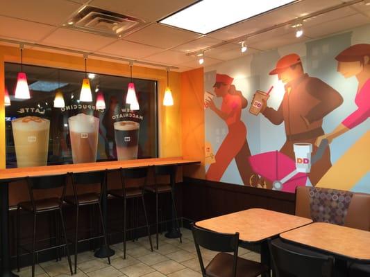 Window seating and a brightly colored wall mural provide customers with options for the eyes.