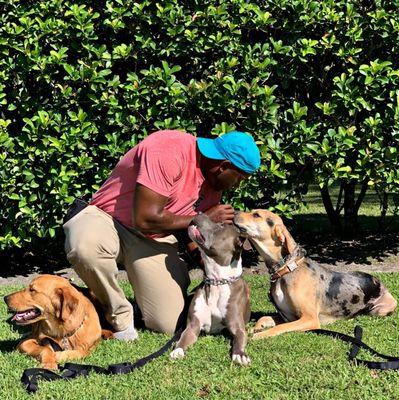 Florida's Best Dog Trainer Laurent Gabriel bonds with dogs before training begins.