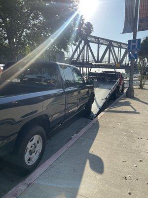 Tow - red truck  Dispatched by auto club .