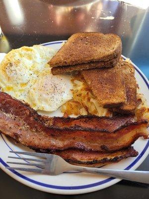 Perfect eggs over medium hanh browns. Toast and thick peppery