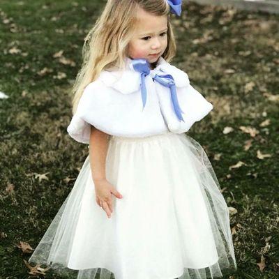 Beautiful flower girl dresses and fur capes.