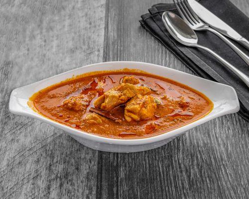 Traditional curry cooked in onion, ginger, garlic and tomato-based sauce.