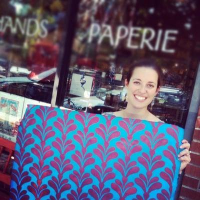 Just A Trace Stencil owner Libby Unwin shows her freshly stenciled paper at a stencil demonstration.