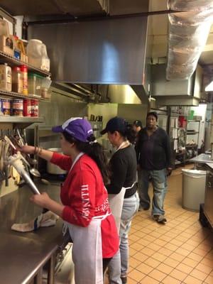 Co-volunteers preparing hot meals