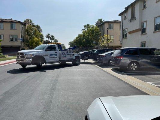 Lima perfectly parking my car backwards in his tow truck. Dead on center.