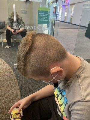 Another angle of the uneven wreck of a haircut