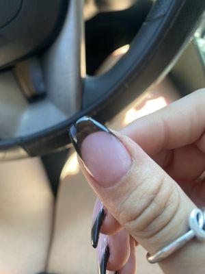 Not enough nail polish was applied and black tips are see through. Shape and length is different for some nails.